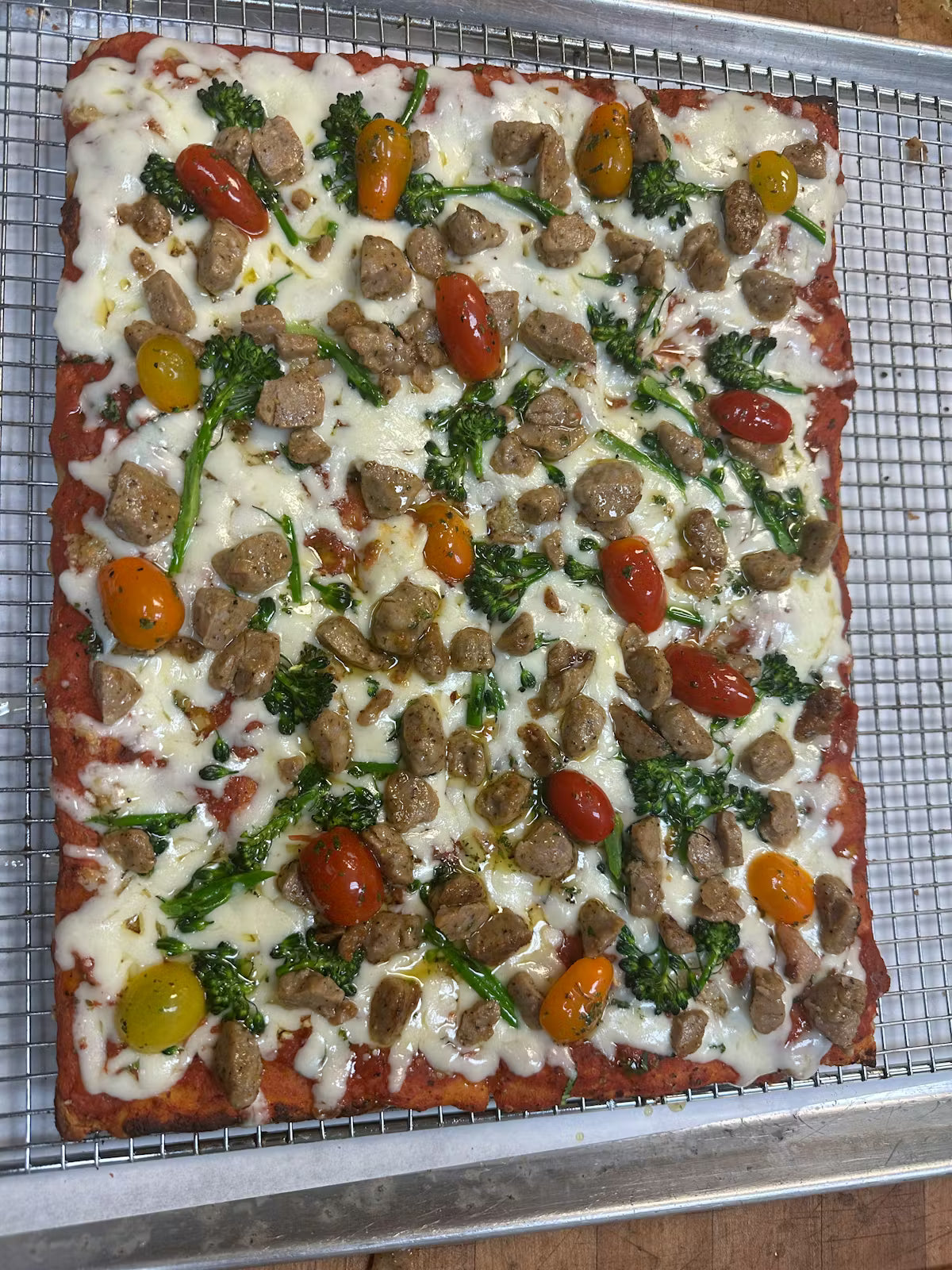 Rectangular Slices Roman-style pizza baked in a black-steel pan