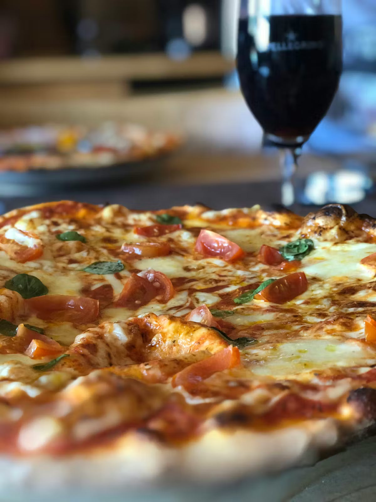 Pizza and wine arranged for a Slices wine pairing guide